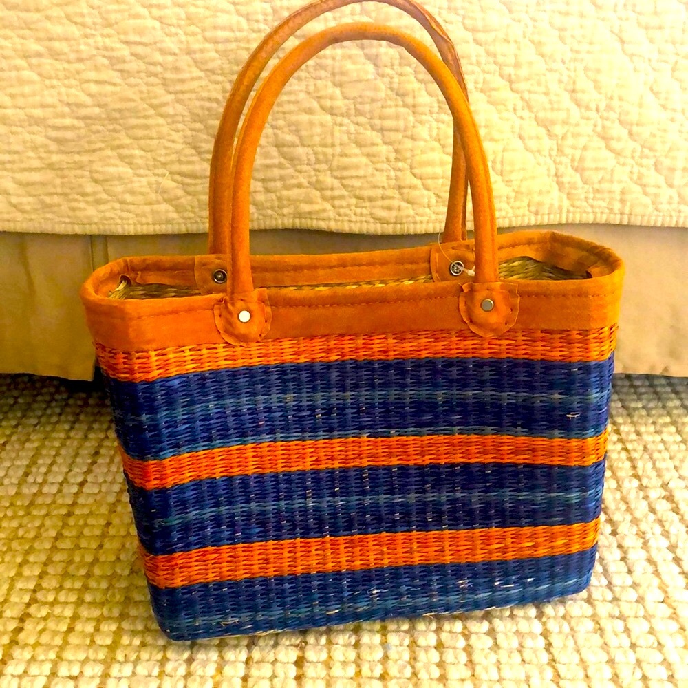 Gorgeous brand new straw tote bag.   14x10 suede handles